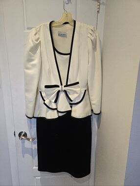 White and Black Peplum Dress with Bow Accent